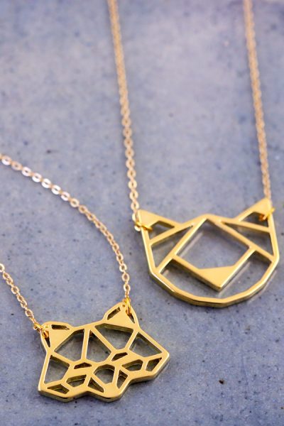 On trend, geometric fox face pendant in gold. Also available in cat face and bear face.